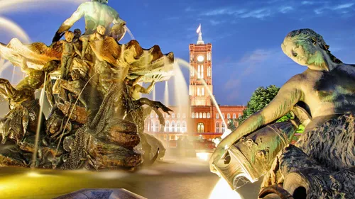 Neptune Fountain sculptures with building background.
