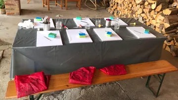 Art station setup with canvases and brushes.