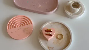 Decorative trays and rings on table.