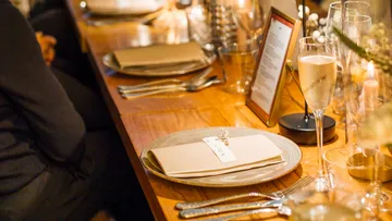 Elegant table setting with menu card.