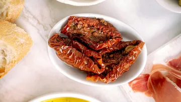 Sundried tomatoes in a white bowl.