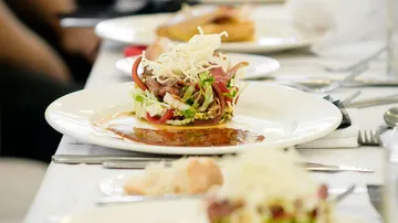 Gourmet salad with vegetables on elegant table.