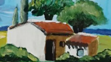 House with trees in countryside setting.