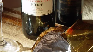 Port wine bottles and unwrapped chocolate.