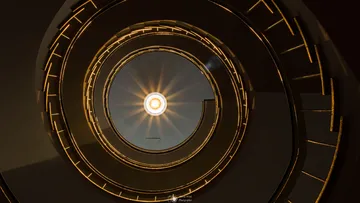 Spiral staircase with sunburst at center.