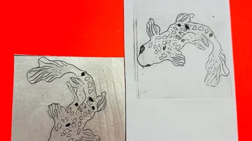 Koi fish sketch and print on red background.