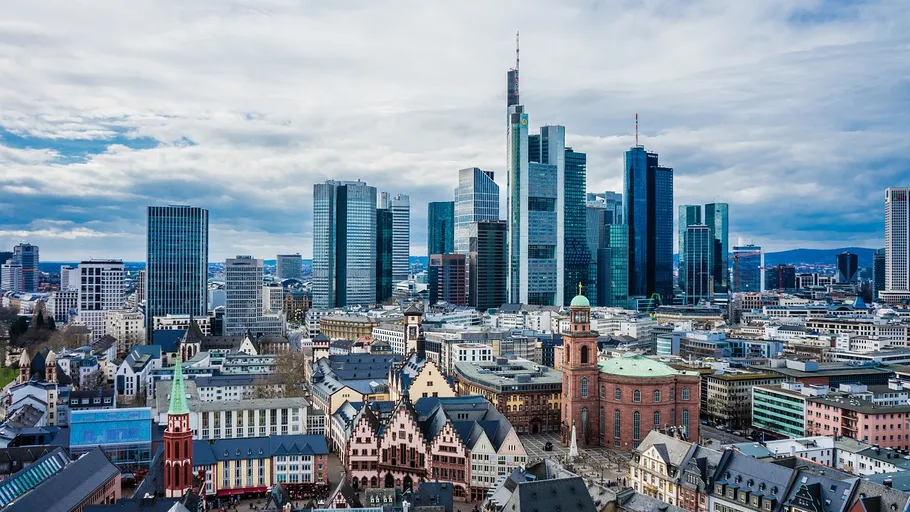 Frankfurt skyline with modern skyscrapers and historic buildings.