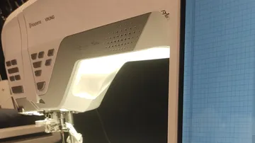 Sewing machine with grid screen display