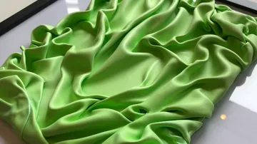 Vibrant green fabric artfully draped.