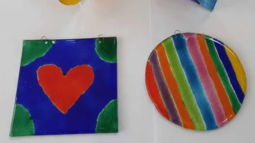 Painted glass squares with heart and stripes.