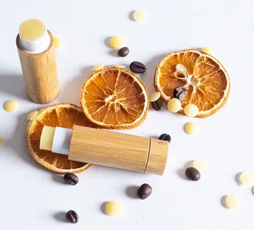 Bamboo lip balm with dried oranges and beans.
