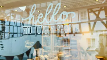 Store window with 'Hello You Lovely People' text.