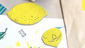 Lemon-shaped stamps and prints on paper.