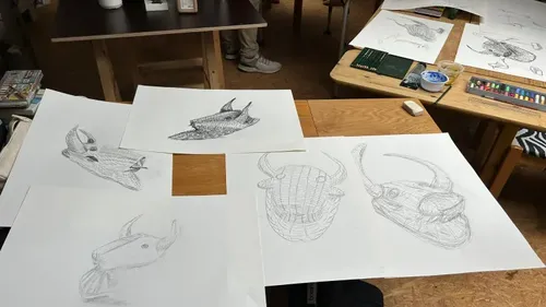 Sketches of animal heads on tables.