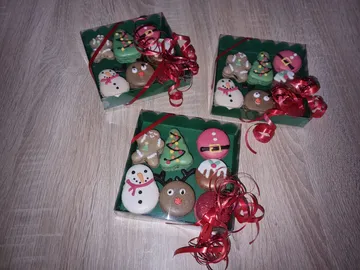 Stacked cookie boxes decorated and presented on a wooden surface