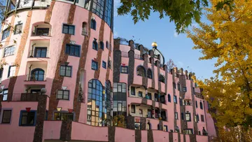 Colorful circular building with unique windows.