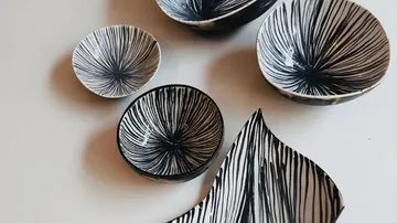 Patterned bowls and plate on table.