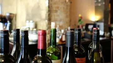 Assorted wine bottles displayed in a restaurant.