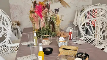 Dining table with dried flowers centerpiece.