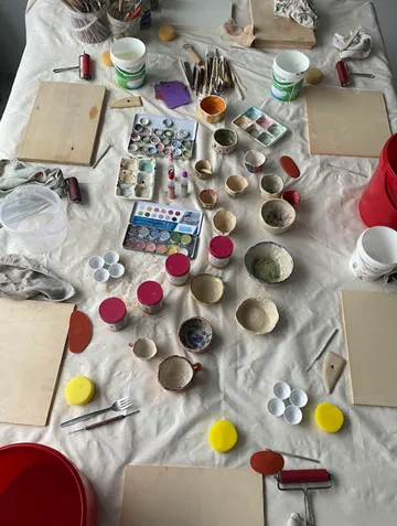 Art supplies arranged on a table.