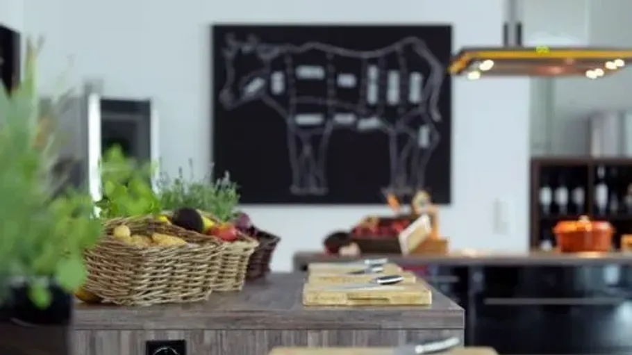 Cutting board and basket in modern kitchen.