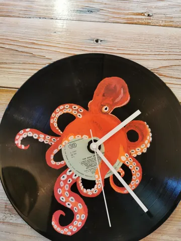 Vinyl record clock with octopus design.