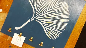 Decorative art piece with abstract floral design.