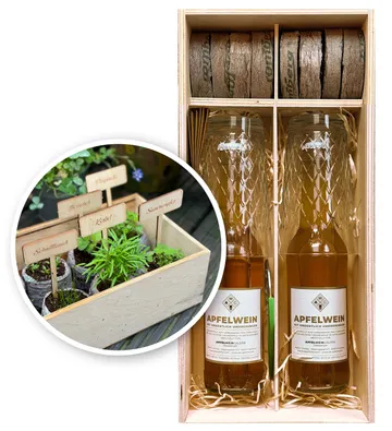 Two apfelwein bottles in wooden box with herb kit.