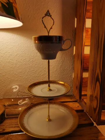 Teacup and saucers stacked as a lamp.