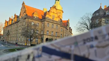 Historic building with map in foreground.