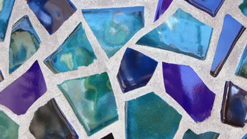 Colorful mosaic with blue and purple tiles.