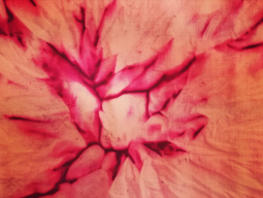 Pink marble finish with branched, dark lines.