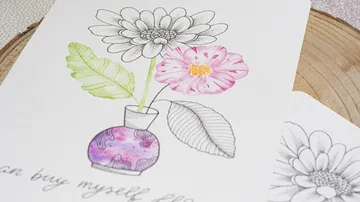 Watercolor flowers in vase on paper.