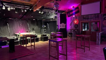 Empty stage with tables in a club.