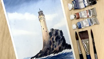 Lighthouse painting with brushes and paint tubes.
