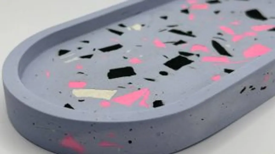 Oval tray with colorful terrazzo design.