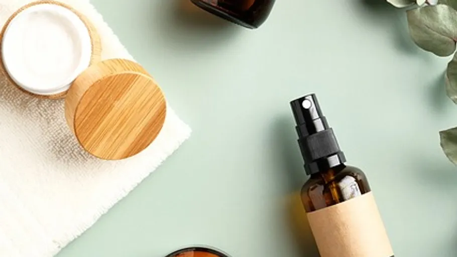 Skincare products on a green background.