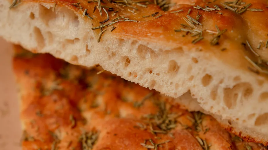 Close-up of rosemary focaccia bread slices.