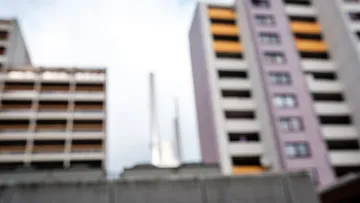 Blurred buildings with cloudy sky background.