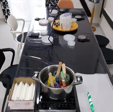 Table setup for candle making workshop.