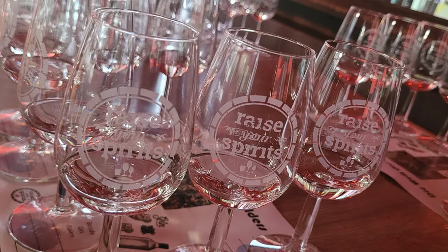 Wine glasses with raised text in restaurant.