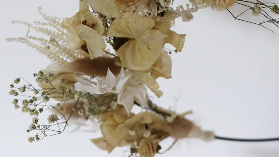 Dried flowers arranged in a wreath.