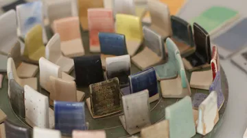 Colorful ceramic tiles displayed in circles.