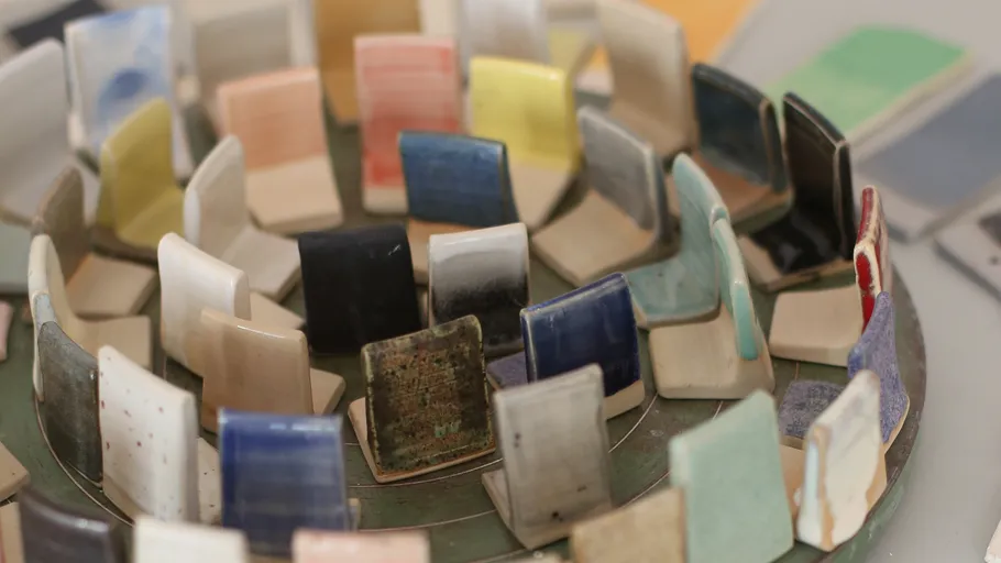 Colorful ceramic tiles displayed in circles.