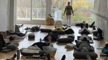 People resting in a yoga studio.