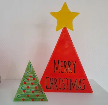 Two ceramic trees with Christmas text.