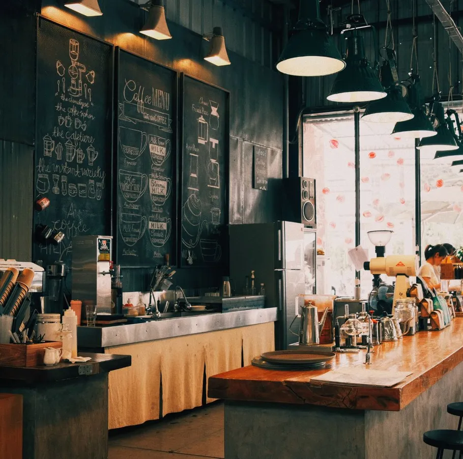 Cozy coffee shop with chalkboard menu.