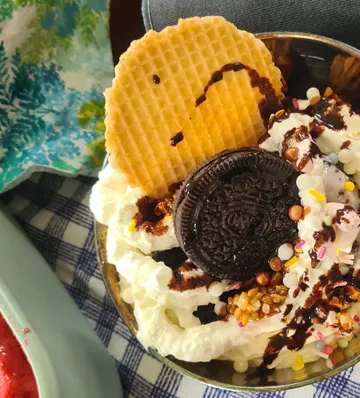 Ice cream with waffle and chocolate topping.