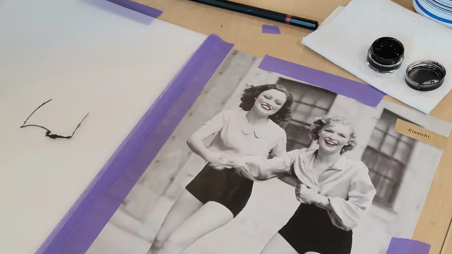 Photo of two women running, art materials nearby.