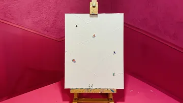 Canvas with small skiers on pink background.